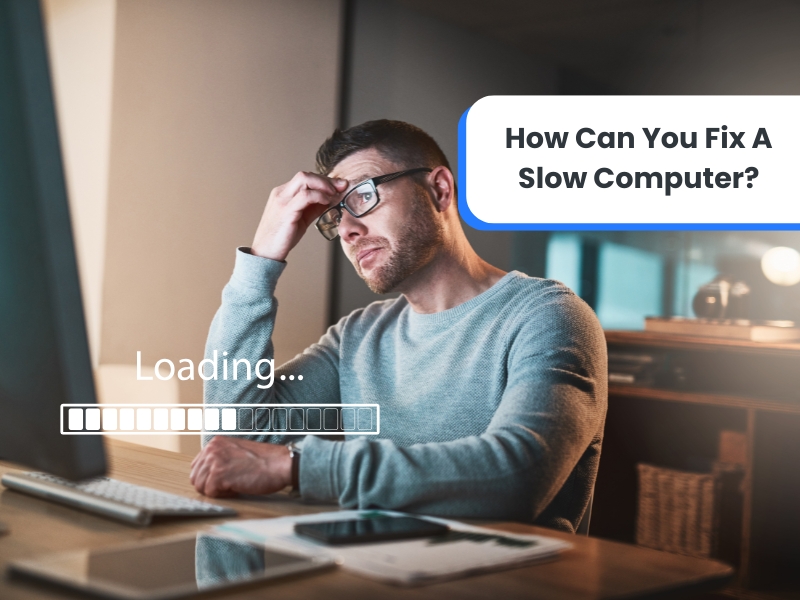 Frustrated man waiting for a slow computer to load, looking for solutions to improve speed.